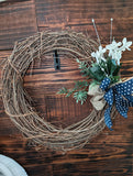 18 inch grapevine wreath-Navy Bow with white polka dots and pearl accents
